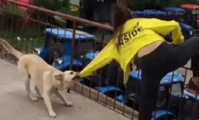 A woman pretending to jump off a building and commit suicide