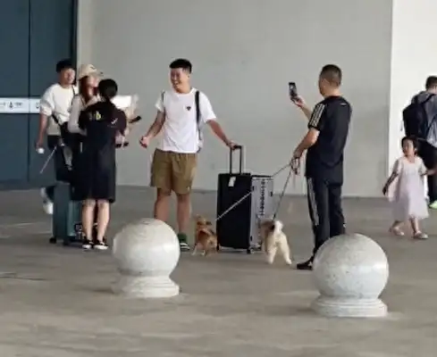 The couple brought two dogs to pick up their sons and girlfriends and brought flowers and warm and loving
