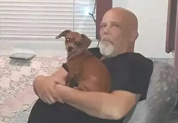 The dog was lying in the hospital bed crying and he didn't want to leave