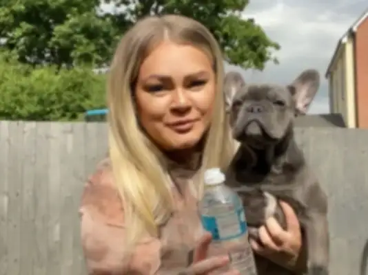 A fighting dog outside the country only drinks bottled water