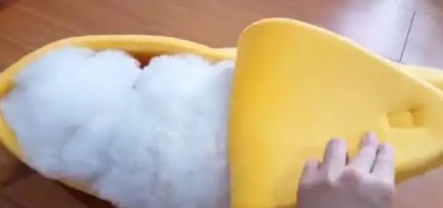 Super cute bear-dogs crawling into a banana break