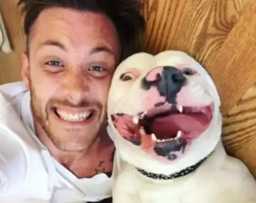 I can't believe they found a picture of him and his dog on the Internet. The door