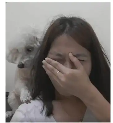 The master pretends to cry in front of the dog, and the dog reacts to make the owner cry